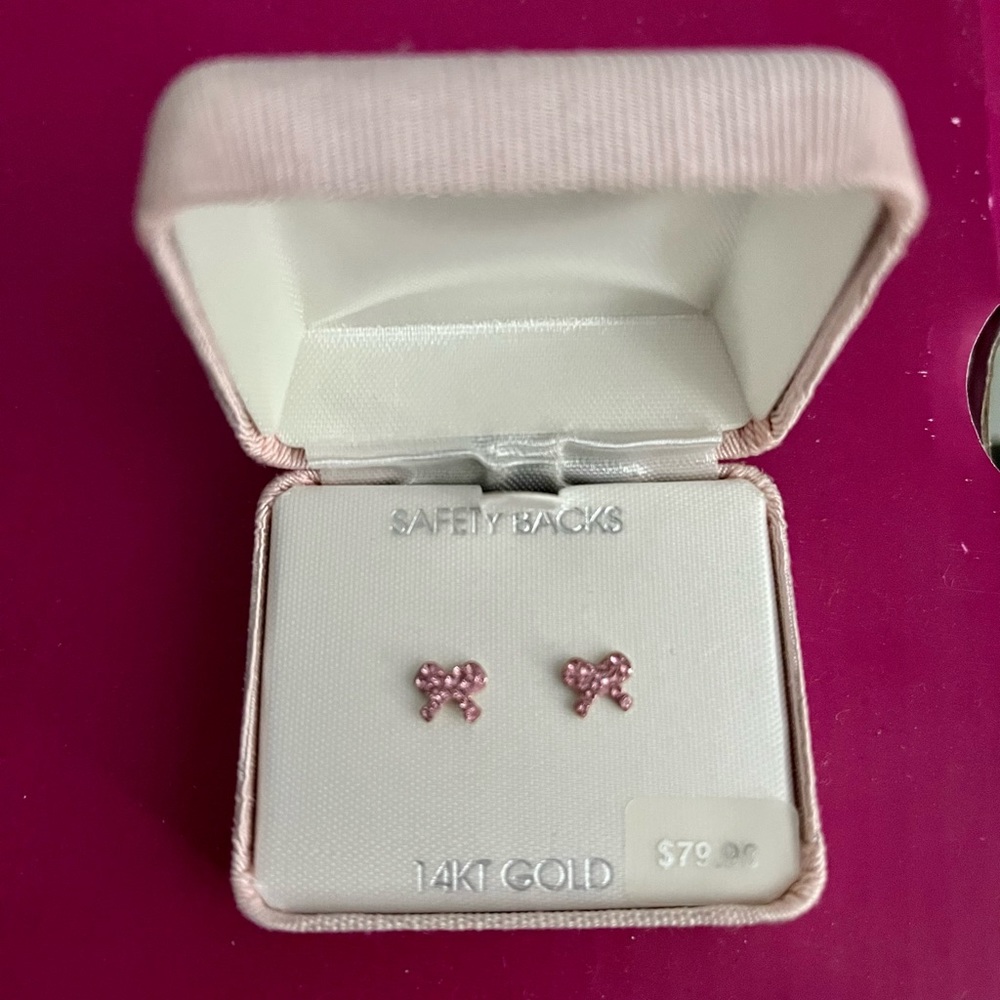 Used…Cute pink bow earrings with safety backings that screw on